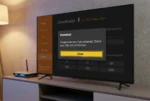 Schermo TV che mostra l'errore di connessione dell'app Downloader su Amazon Fire TV Stick con un router accanto